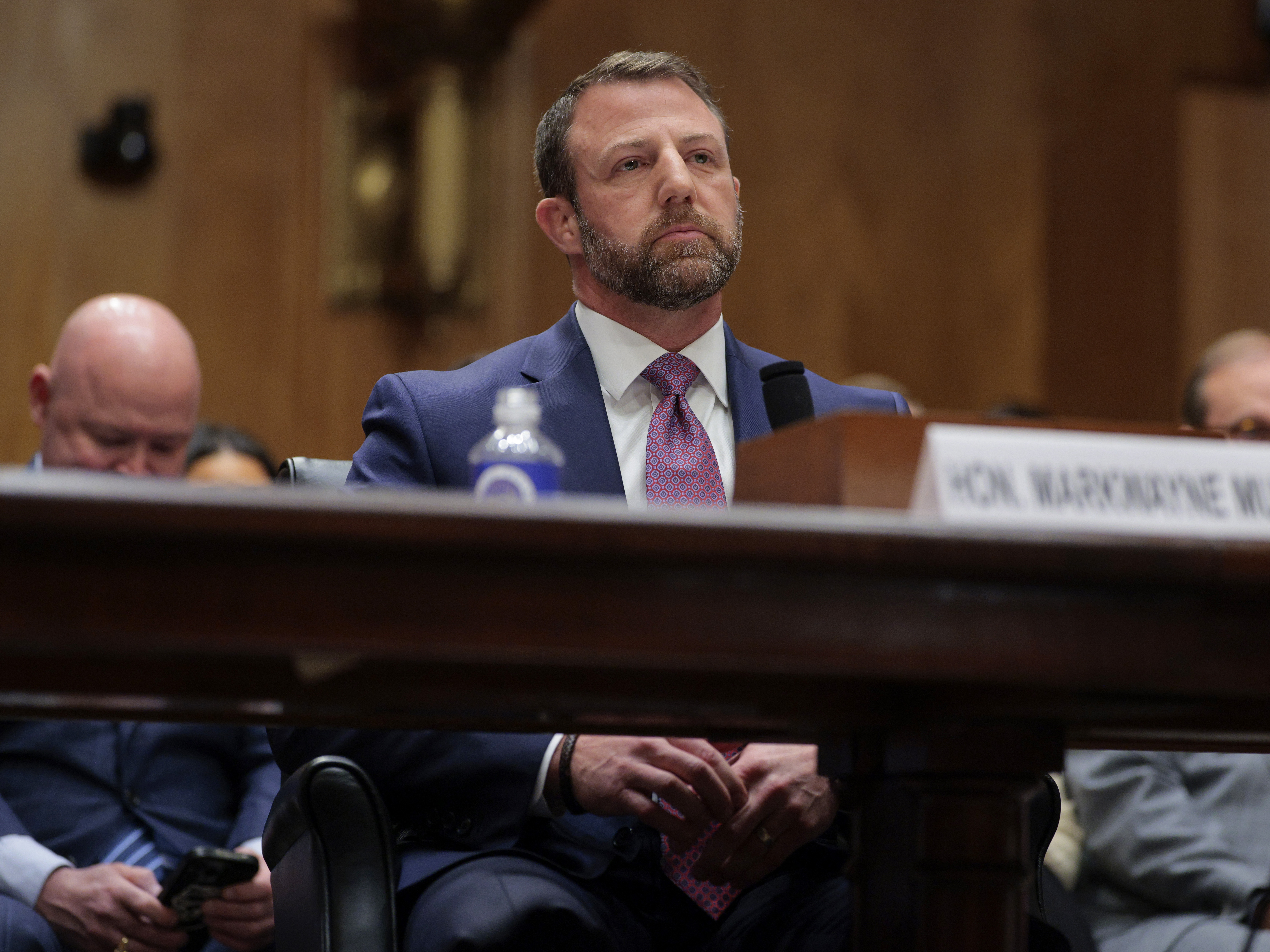 caption: Sen. Markwayne Mullin, R-Okla., testifies during a confirmation hearing to be the next secretary of the Department of Homeland Security on March 18. President Trump nominated Mullin to replace Kristi Noem as DHS Secretary.