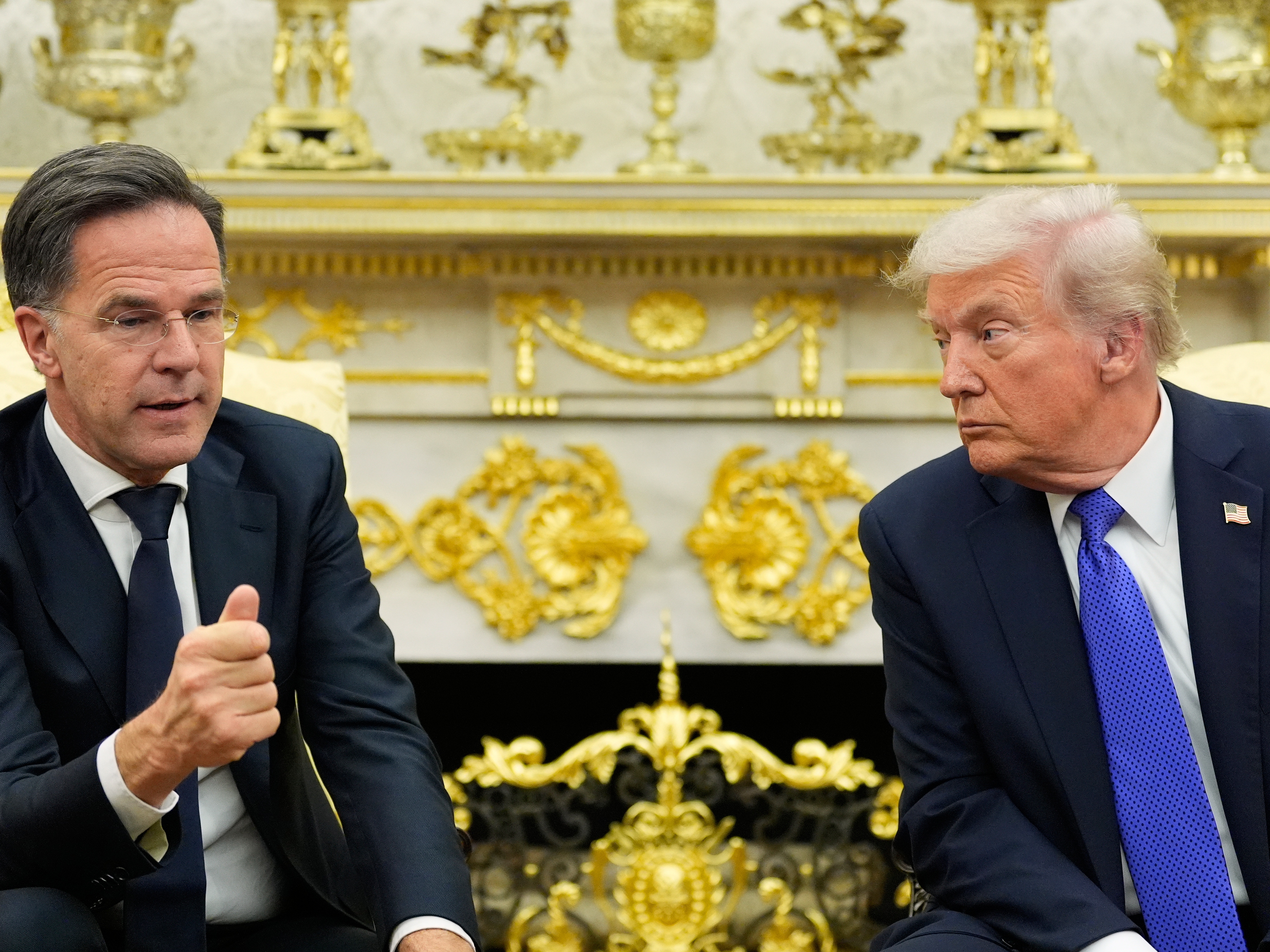 caption: President Donald Trump meets with NATO Secretary General Mark Rutte in the Oval Office of the White House on Oct. 22, 2025, in Washington.