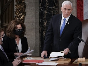 caption: Senate parliamentarian Elizabeth MacDonough works beside then-Vice President Mike Pence earlier this year during the certification of 2020 Electoral College ballots, in the House chamber of the U.S. Capitol.