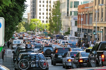 caption: Traffic on Second Avenue in downtown Seattle.