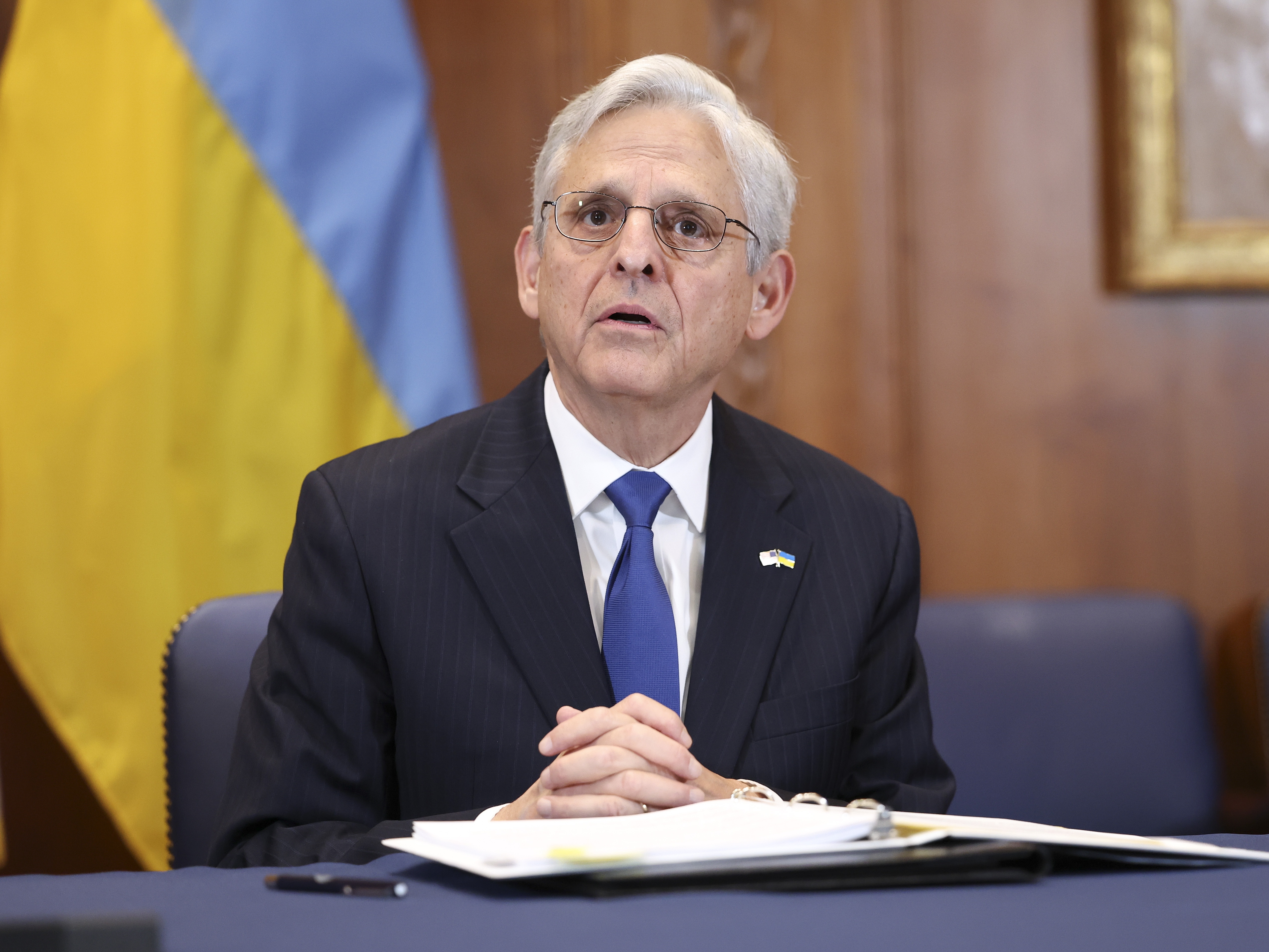 caption: U.S. Attorney General Merrick Garland delivers remarks alongside Ukrainian officials at the Department of Justice in 2022 in Washington, D.C.