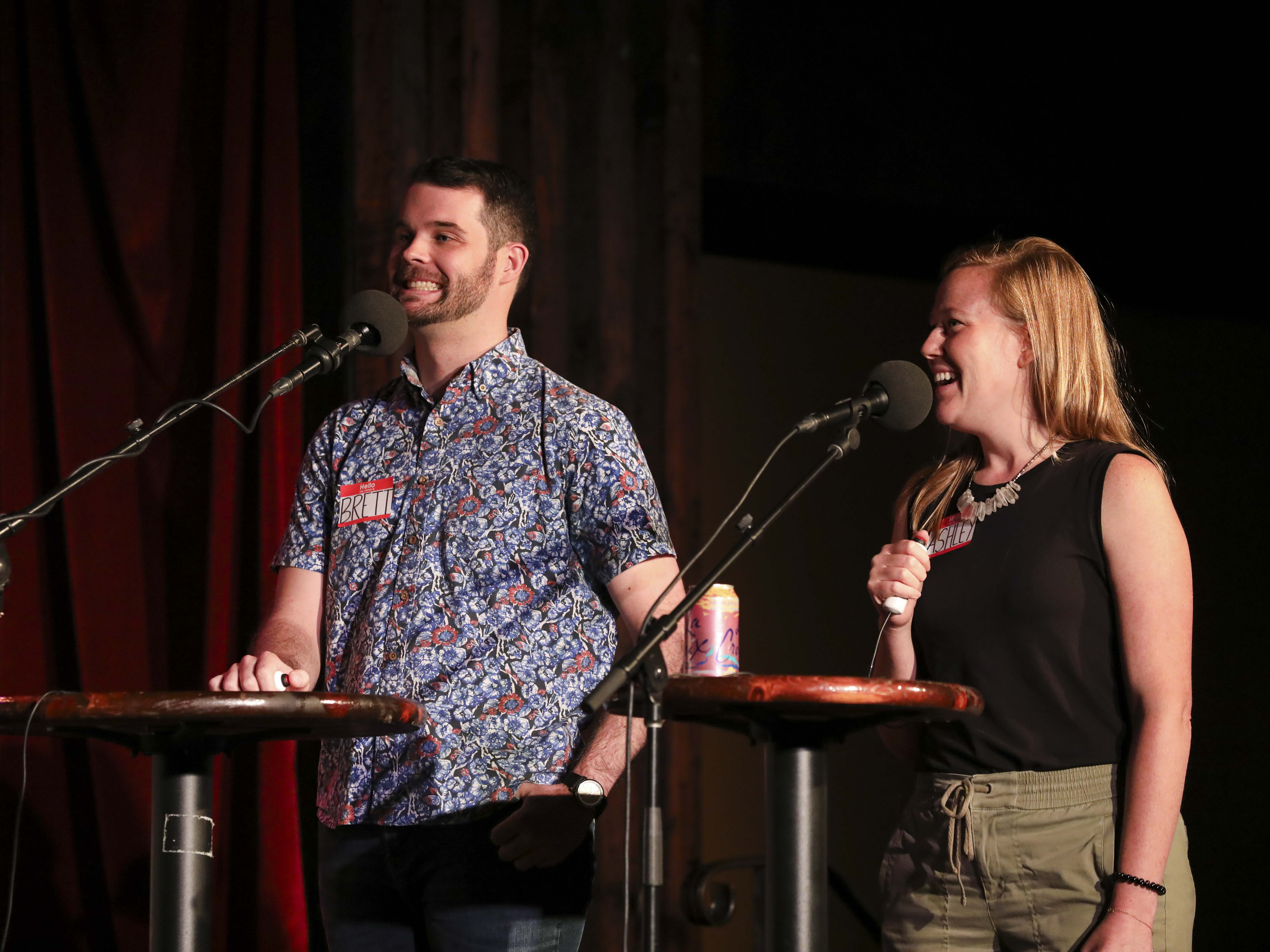 caption: Contestants Brett Greenfield and Ashley Davis appear on <em>Ask Me Another</em> at the Bell House in Brooklyn, New York.
