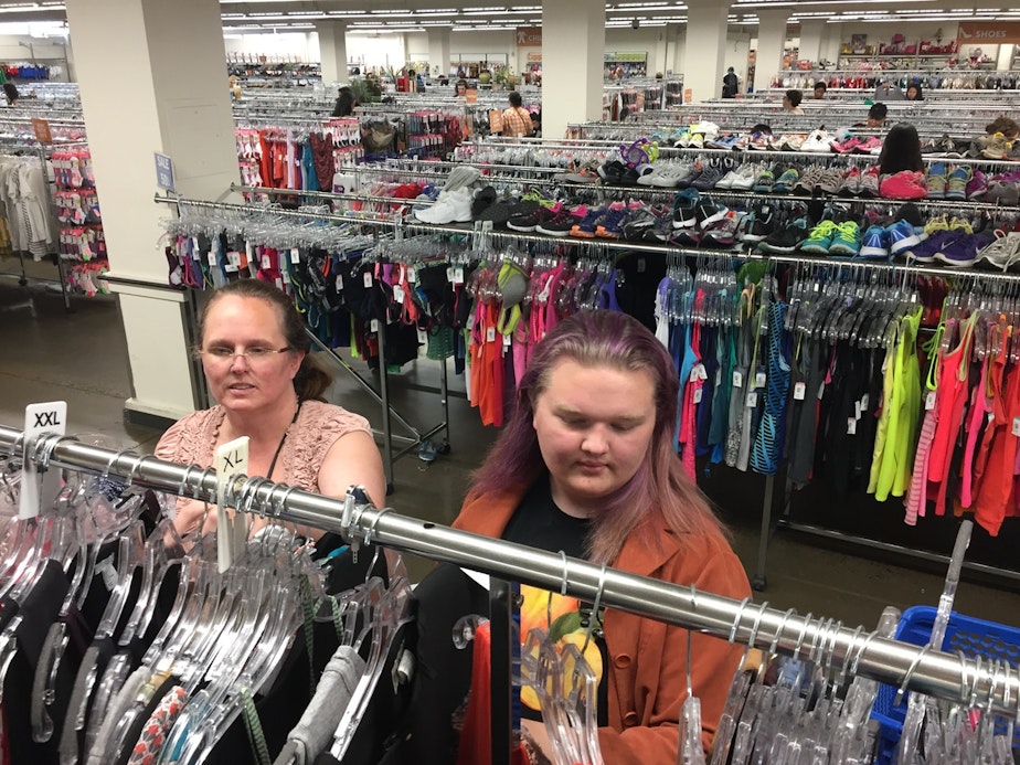 caption: RadioActive youth producer Marceline Flynn (right) and their mom shop for dresses together. Marcie's story on non-binary gender identity was one of the "homework" assignments for Curiosity Club's final dinner. 