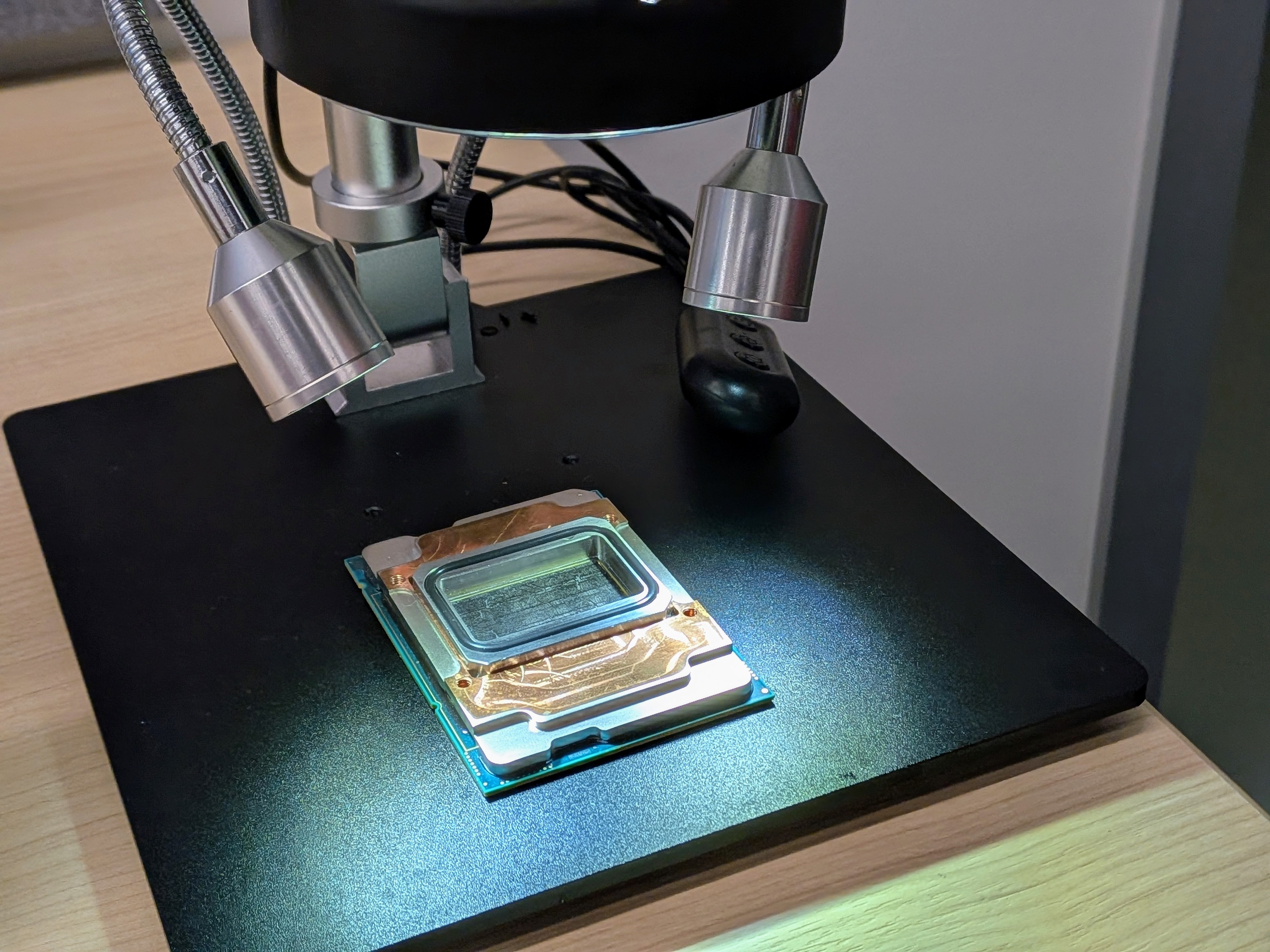 caption: Microsoft is developing technology that allows cooling liquid to be injected directly into AI chips.