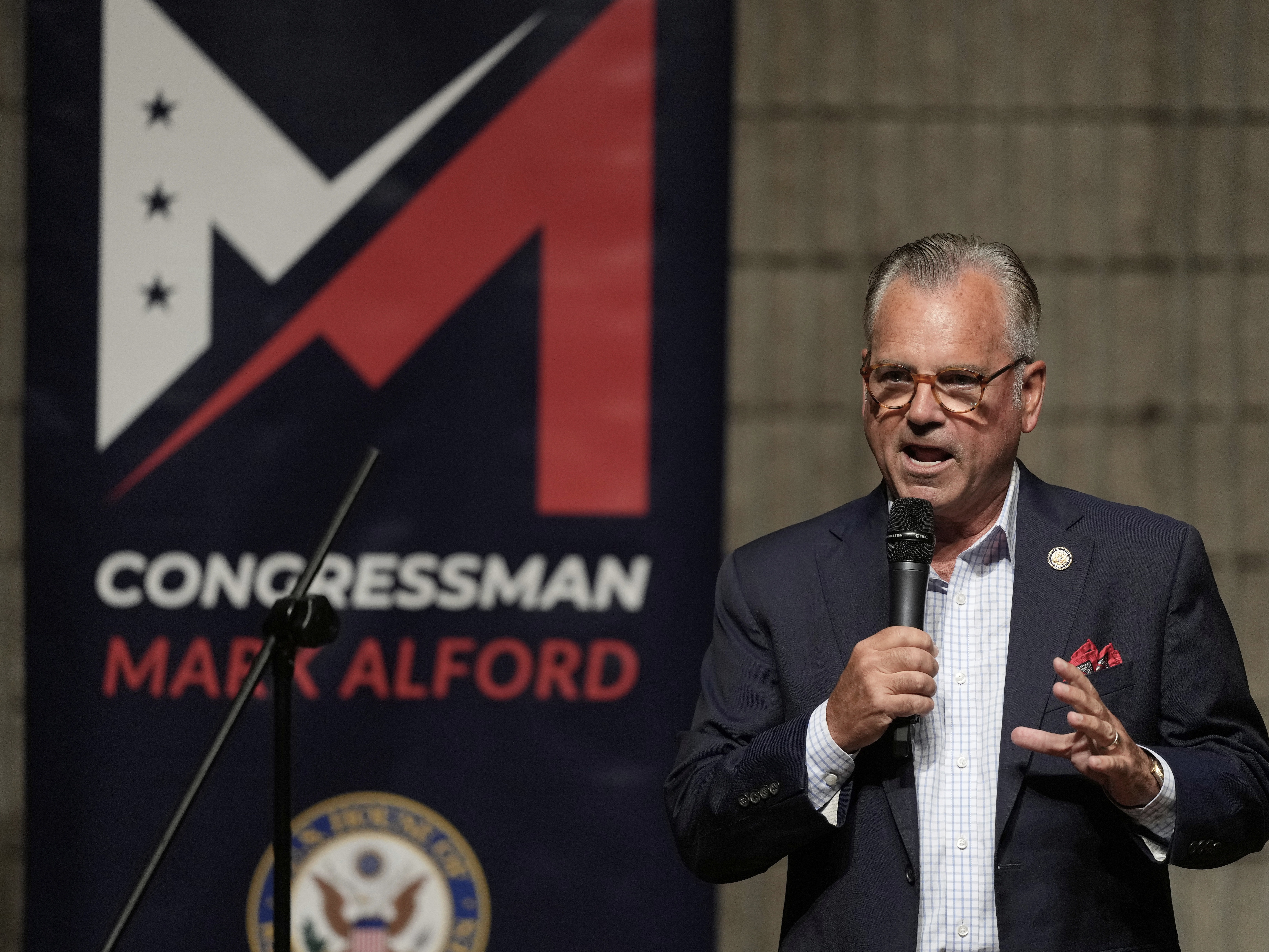caption: Republican Rep. Mark Alford addresses attendees at a town hall Monday in Bolivar, Mo.