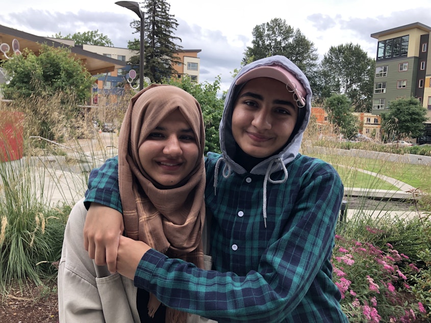 caption: Nila and Ada Safi have written poetry about their refugee journey through a program at Foster High School in Tukwila.