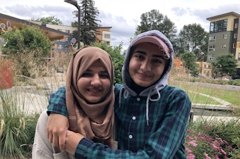 caption: Nila and Ada Safi have written poetry about their refugee journey through a program at Foster High School in Tukwila. 