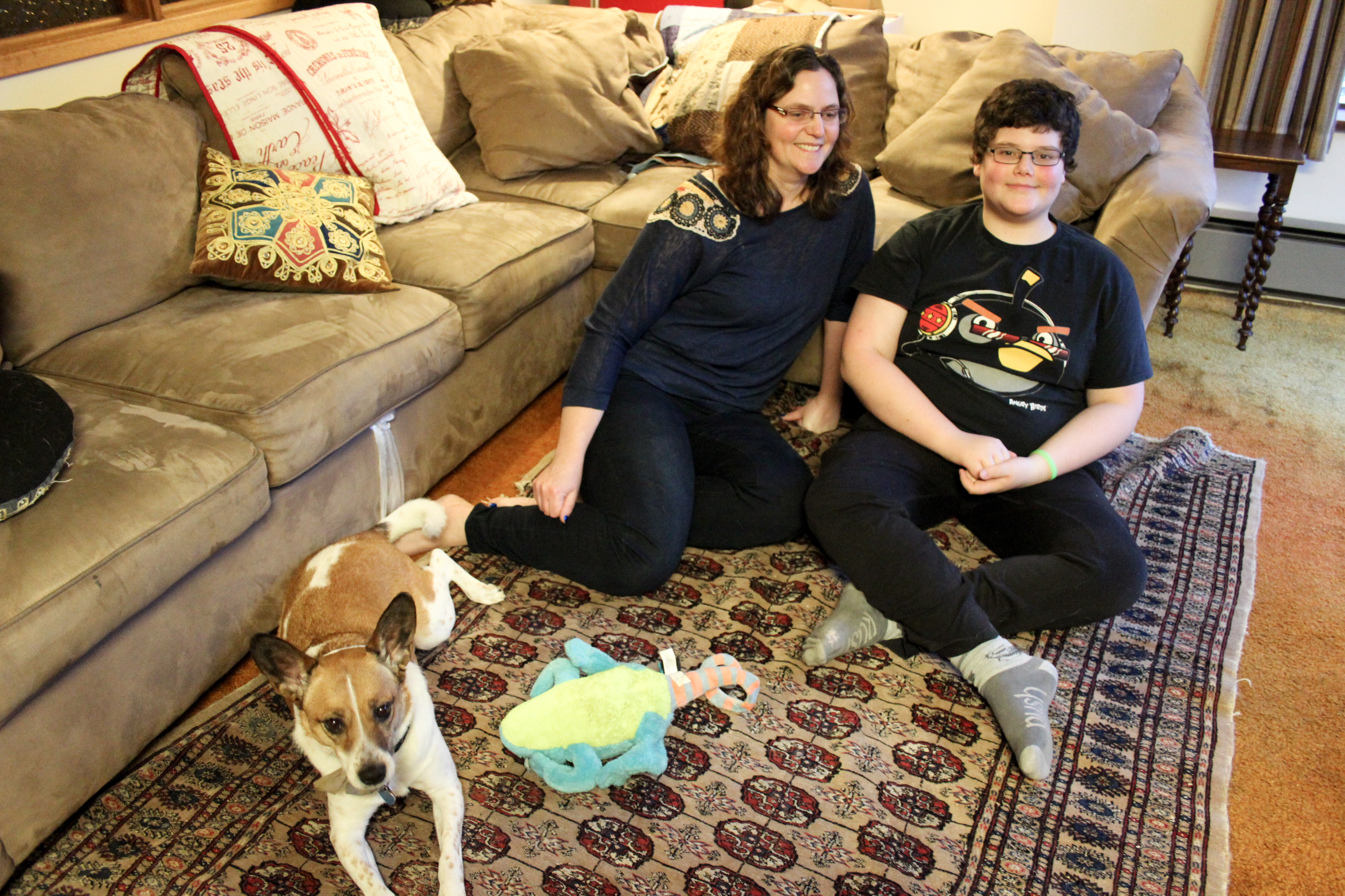caption: Heather Weinert and her son Owain, 13, who was diagnosed with cancer when he was 8.