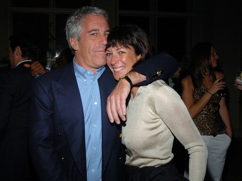 caption: Jeffrey Epstein and Ghislaine Maxwell, shown here in 2005, allegedly ran a sex-trafficking operation together.