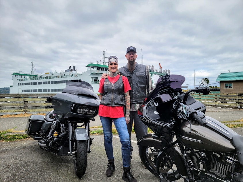 caption: Monica "Mac N Jack" Lear and her husband, Craig, ride their Harleys from Puyallup to the ferry in Tacoma.