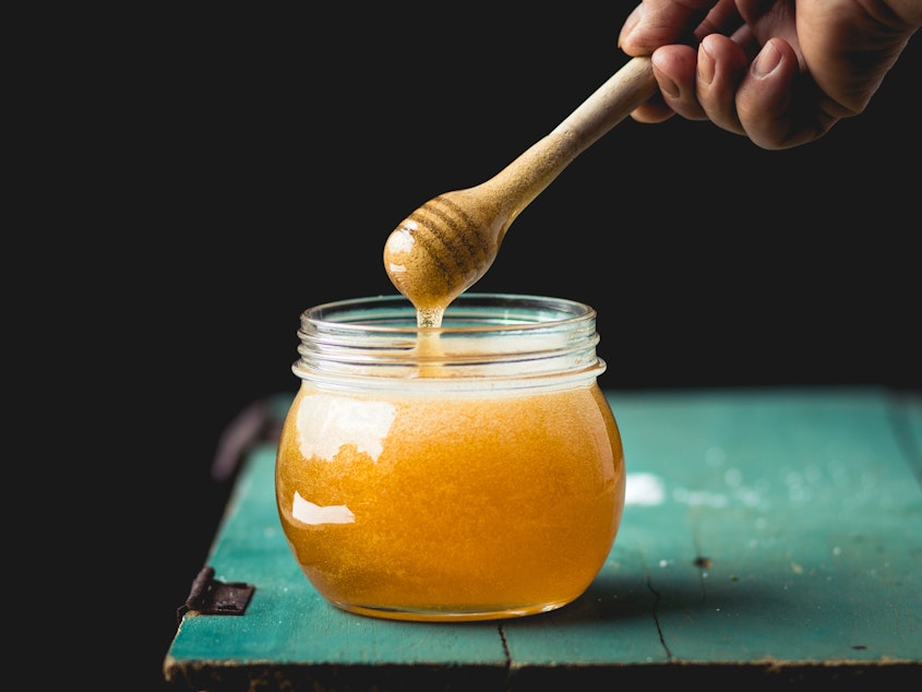 caption: A spoonful of honey makes the medicine...irrelevant. That's because honey works better than cough syrups to help with kids' coughs. But don't give honey to infants under one years old.