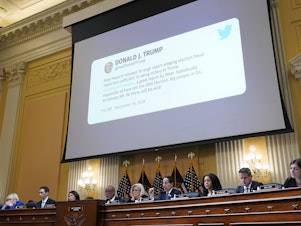 caption: A tweet from former President Donald Trump is shown as the House select committee investigating the Jan. 6 attack on the U.S. Capitol holds a hearing on Tuesday.