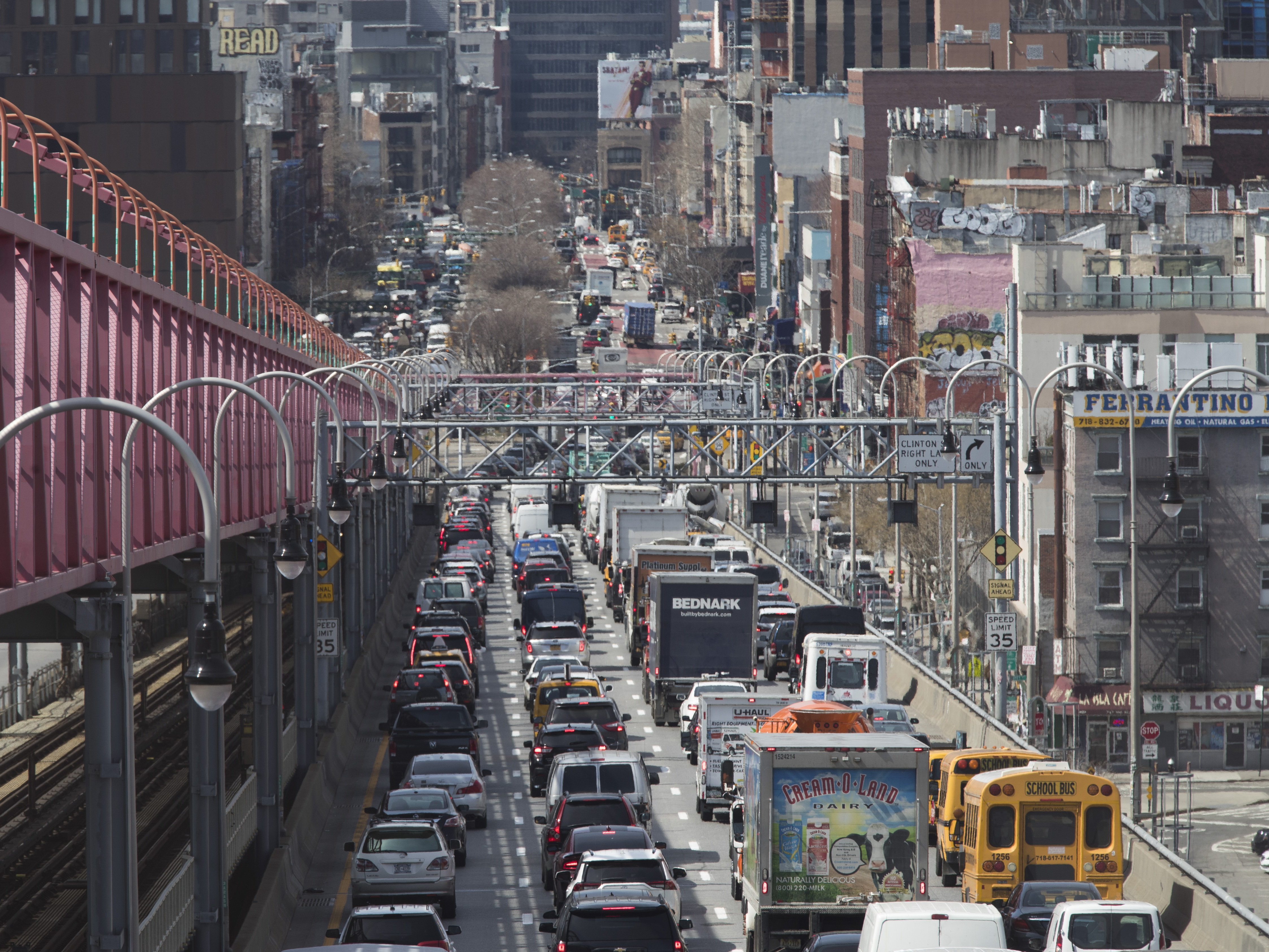 caption: Traffic makes its way into Manhattan over the Williamsburg Bridge in March 2019. New checkpoints at New York City's major bridges, tunnels and other sites are meant to drive home the message that 14-day quarantine rules are mandatory for people returning from states considered coronavirus hot spots.