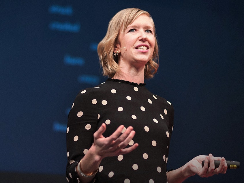 caption: Mandy Len Catron on the TED stage.