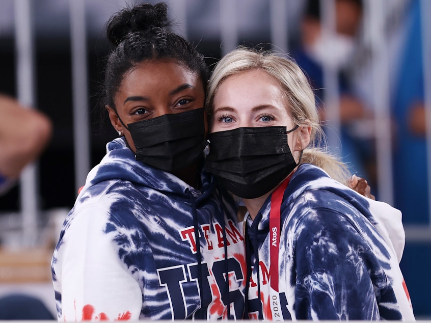 caption: Simone Biles spoke at length about the reasons behind her withdrawal from the gymnastics team final. She's seen here on Wednesday with teammate MyKayla Skinner, as they watch the men's all-around final in Tokyo.