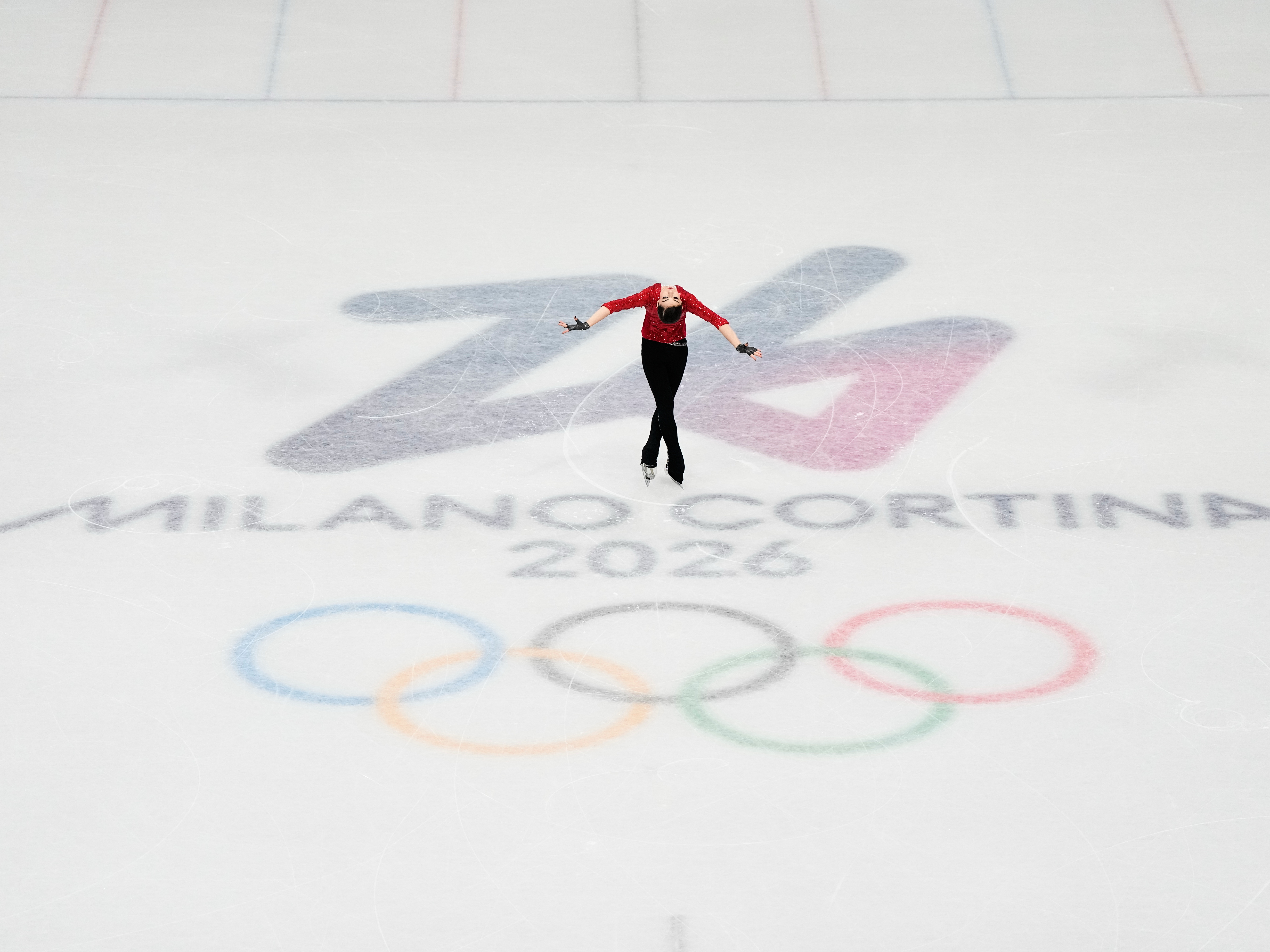 caption: Adeliia Petrosian of Individual Neutral Athletes competes during the women's figure skating short program at the Winter Olympics in Milan on Feb. 17.