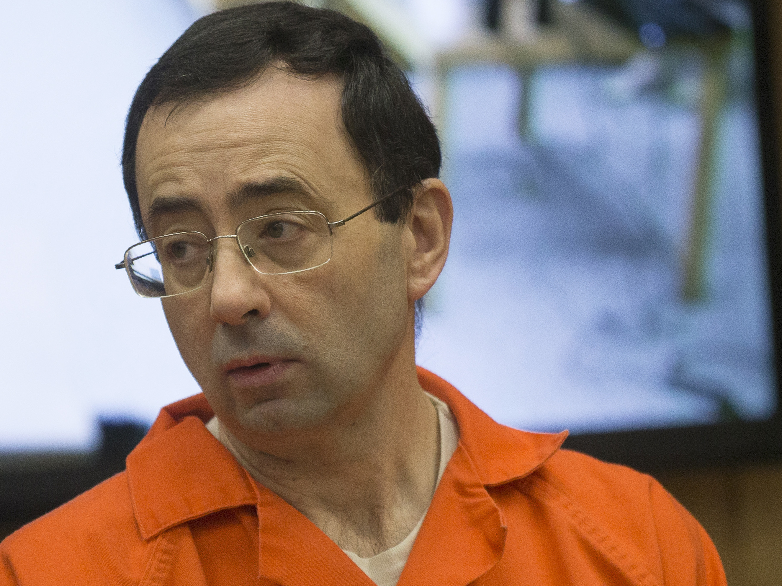 caption: Former Michigan State University and USA Gymnastics doctor Larry Nassar appears in court for his final sentencing phase in Eaton County Circuit Court on February 5, 2018 in Charlotte, Michigan.