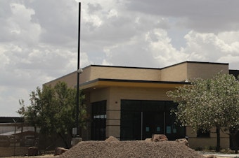 caption: The entrance to the Border Patrol station in Clint, Texas, where reporters were given a tour following outrage over reports of unsanitary detention conditions for migrant children being housed at the Border Patrol facility near El Paso.