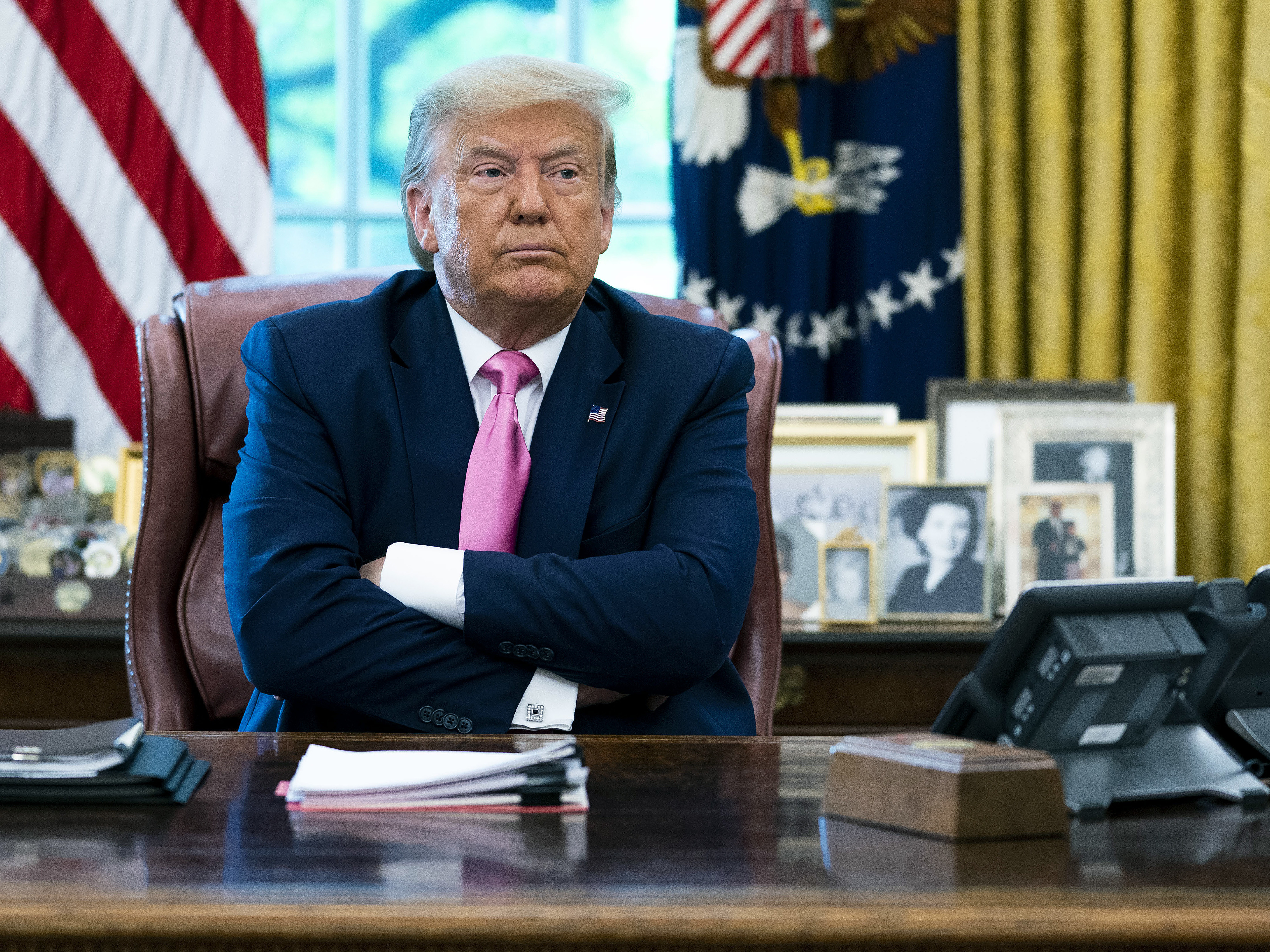 caption: President Trump, seen on July 20, has taken a more somber tone when discussing the coronavirus. The U.S. death toll topped 150,000 on Wednesday.