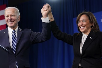 caption: President Biden will deliver his second State of the Union address Tuesday night, with honored guests who embody the administration's policies in attendance. Here, Biden and Vice President Harris stand onstage at the Democratic National Committee's winter meeting on Feb. 3 in Philadelphia.