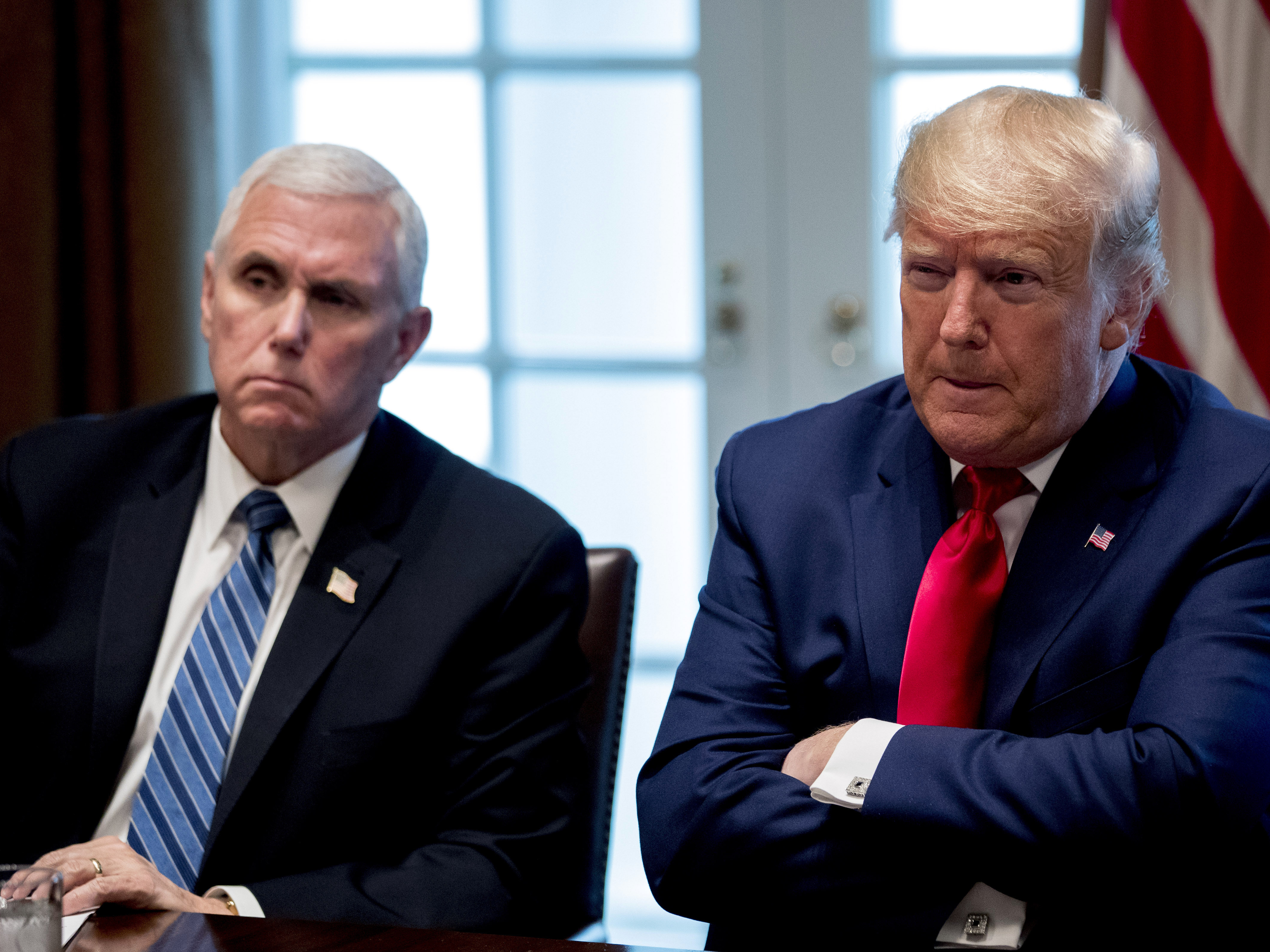 caption: President Donald Trump and Vice President Mike Pence, left, attend a meeting with pharmaceutical executives on the coronavirus in the Cabinet Room of the White House on Monday.