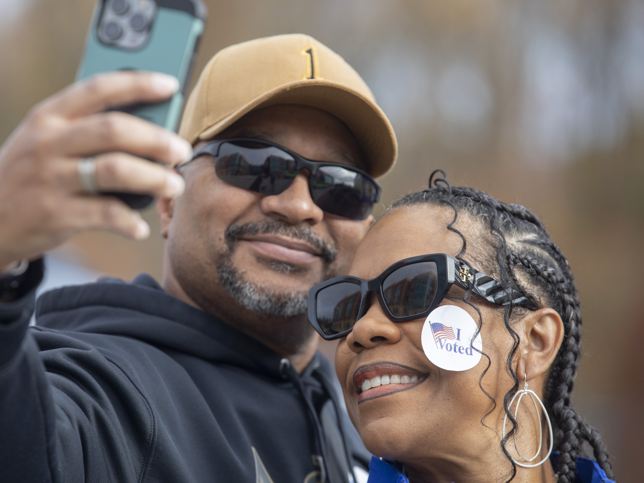 caption: Iris and Burt Foster take a selfie after voting Dr. Henry A. Wise, Jr., High School in Upper Marlboro, Md.