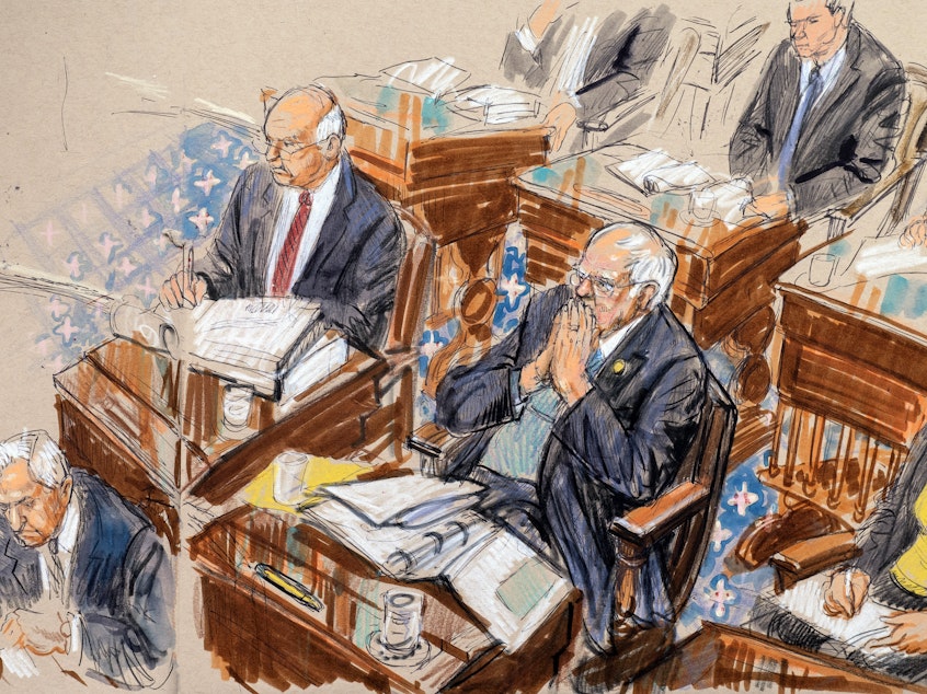 caption: In this artist sketch, Democratic presidential candidate, Sen. Bernie Sanders, I-Vt., flanked by Sen. Ben Cardin, D-Md., left, and Sen. Tammy Baldwin, D-Wis., right, listens during the impeachment trial of President Donald Trump. Several Senators report that the trial's strict rules and long hours make are testing their mental fortitude.