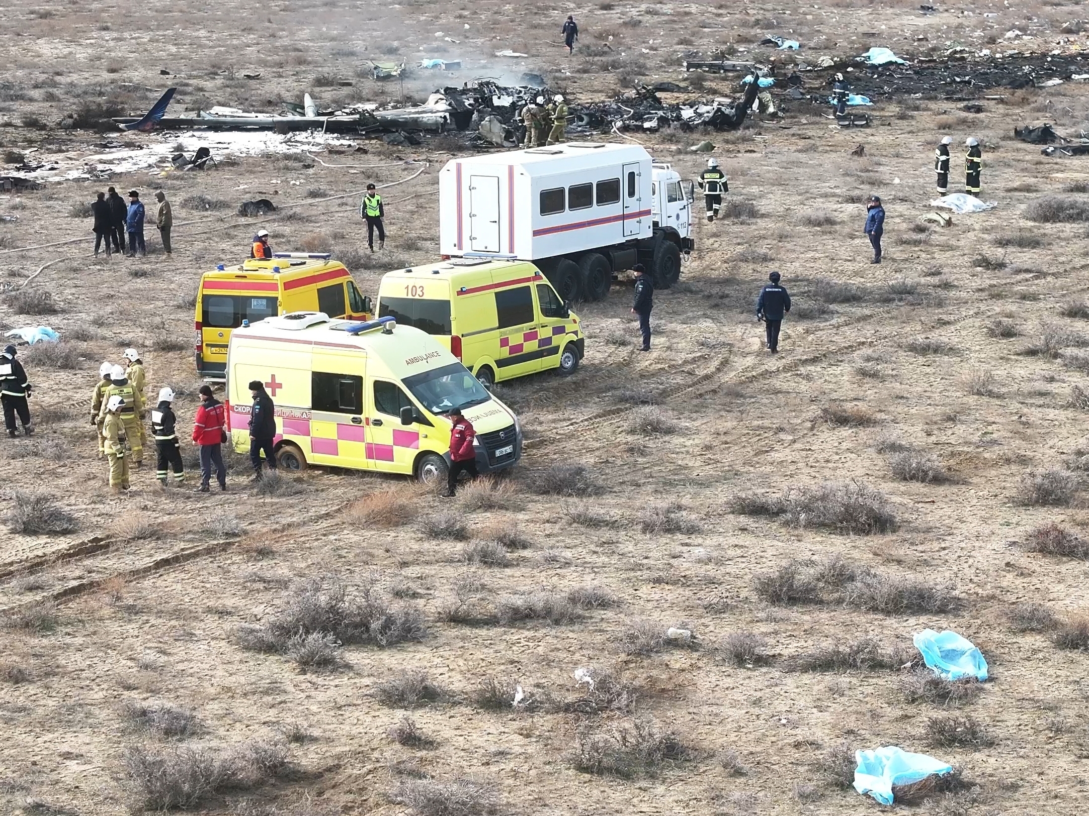 caption: The wreckage of Azerbaijan Airlines Embraer 190 lays on the ground near the airport of Aktau, Kazakhstan, on Wednesday.