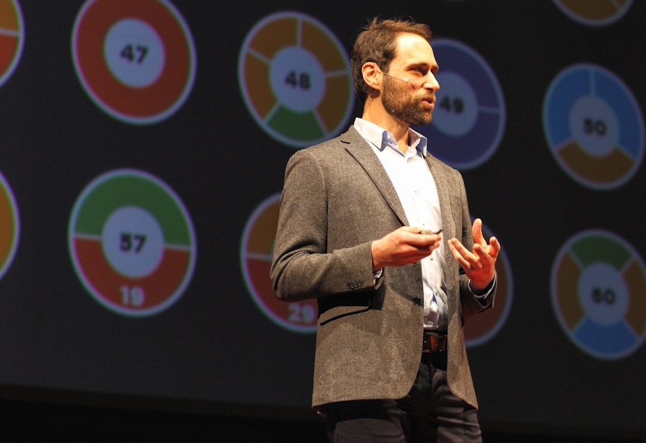 caption: Dan Finkel on the TED stage.