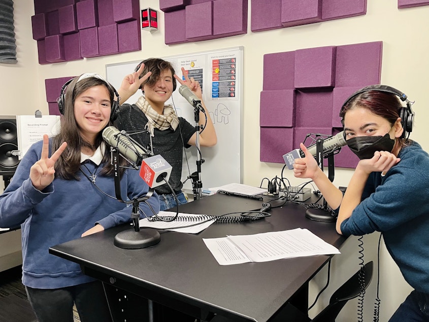 caption: Kea Lani Diamond, Hayden Andersen and McKenna Kilayko record a podcast in the RadioActive studio on November 29, 2022. 