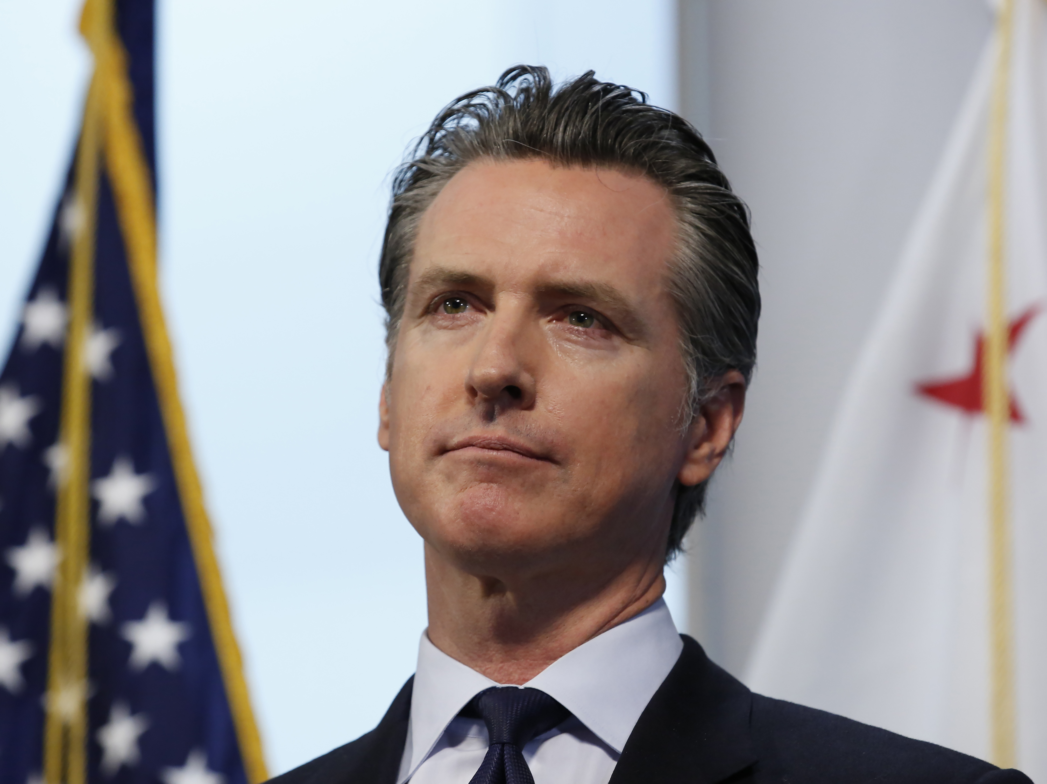 caption: Gov. Gavin Newsom, pictured on Monday, says California has reduced a backlog of testing. The state is asking for contributions of medical supplies with a new website.