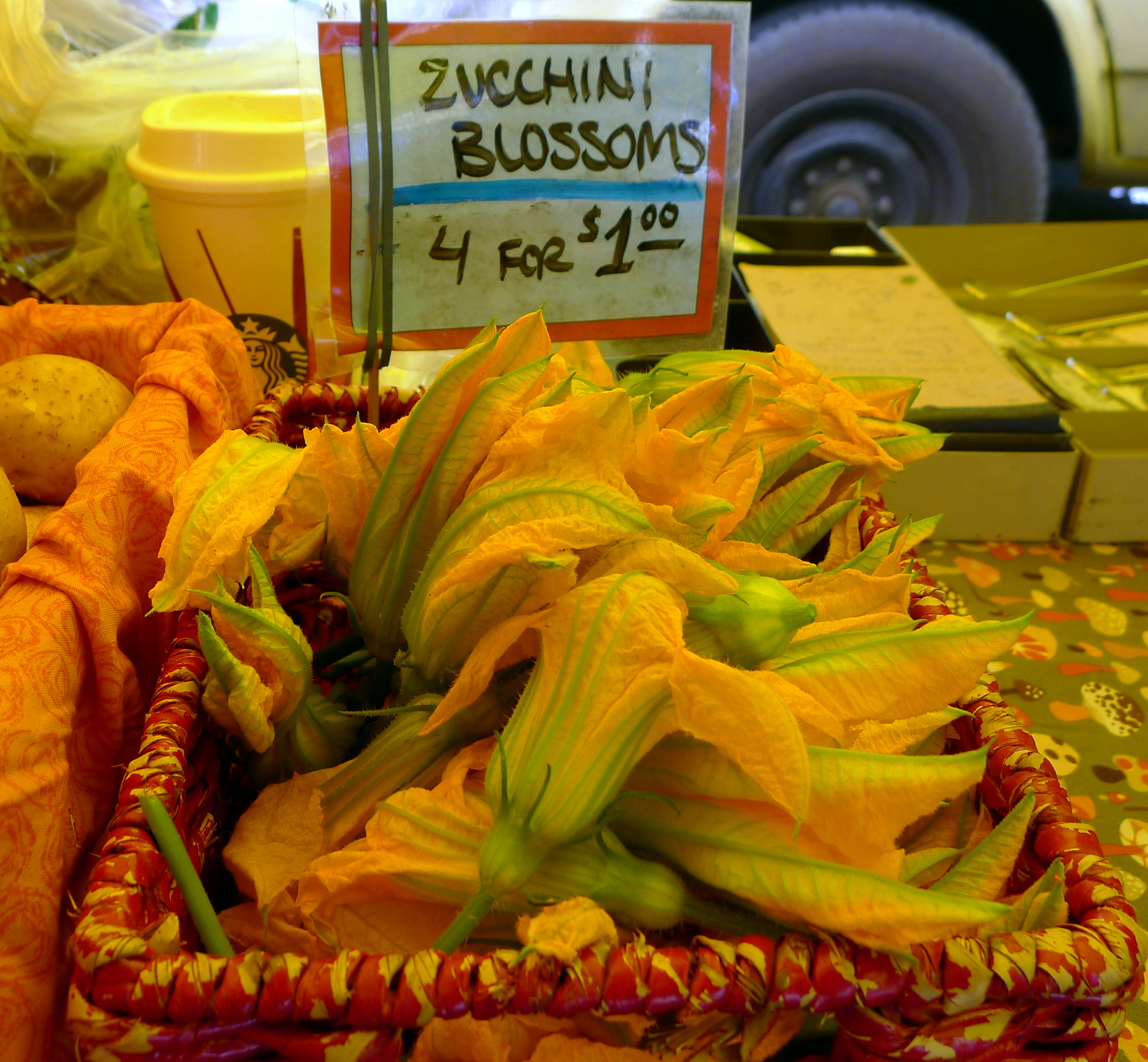 caption: Zucchini blossoms at West Seattle Farmers Market