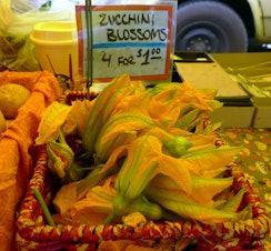 caption: Zucchini blossoms at West Seattle Farmers Market
