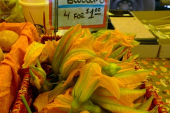 caption: Zucchini blossoms at West Seattle Farmers Market