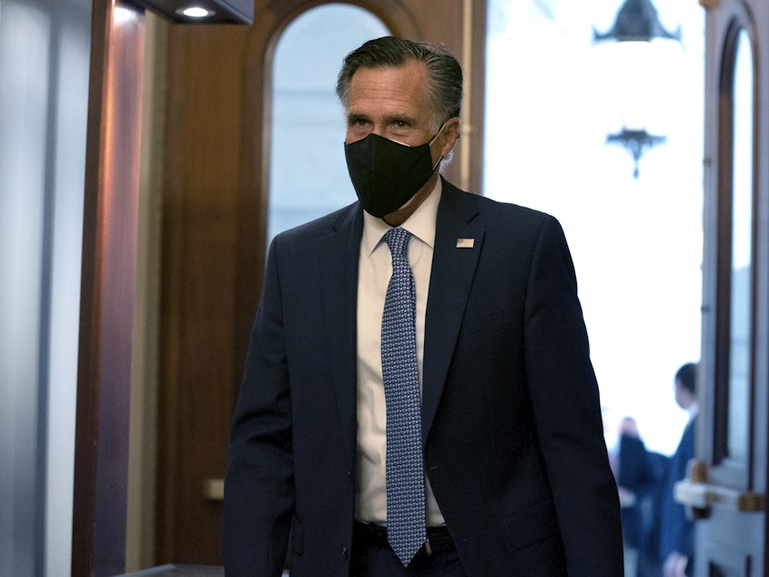 caption: "President Trump has disrespected the American voters, has dishonored the election system and has disgraced the office of the presidency," Sen. Mitt Romney told reporters Wednesday. Here Romney arrives at the U.S. Capitol last month.