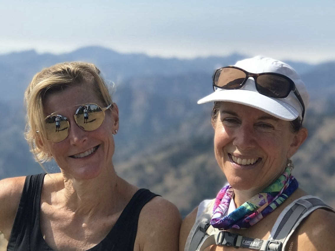 caption:  Molly Baker (right) poses with her unsung hero, Carla Vail, who came up with a novel way to support Baker after her husband died.