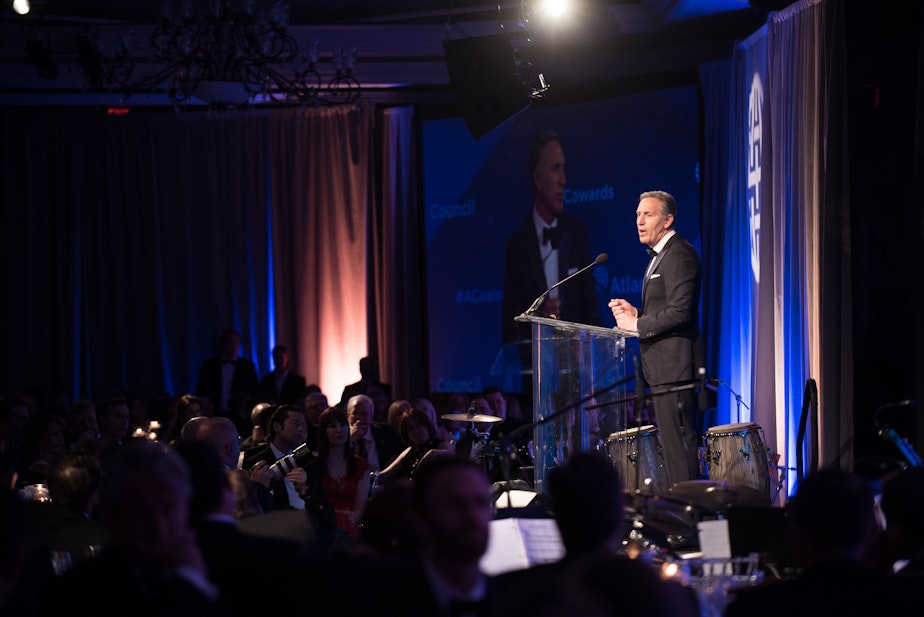 caption: Howard Schultz, former Executive Chairman of Starbucks Corporation, speaks after receiving the Distinguished Business Leadership Award, during the Atlantic Council’s Distinguished Leadership Awards dinner in Washington, D.C., May 10, 2018.  (DoD Photo by U.S. Army Sgt. James K. McCann)