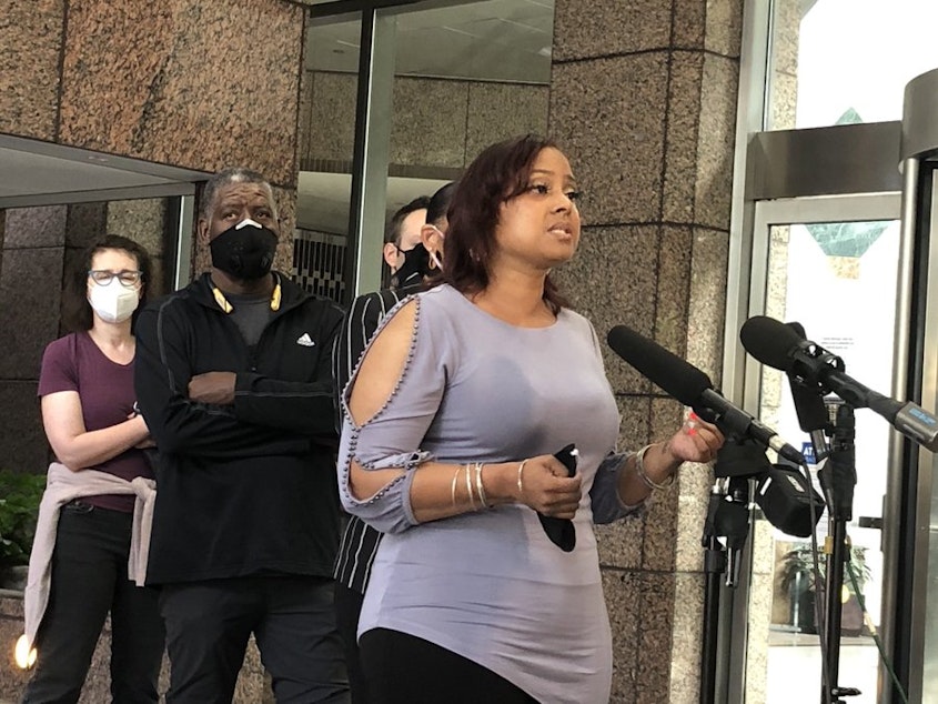 caption: Devitta Briscoe with Not this Time speaks at a press conference Aug. 20, 2020 in support of Seattle Police Chief Carmen Best. 