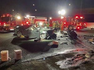 caption: Fire officials said the Tesla driver was killed and a passenger was critically injured Saturday when the car plowed into the firetruck parked on a Northern California freeway.