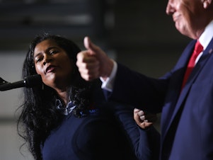 caption: Kristina Karamo, who is running for the Michigan Republican Party's nomination for secretary of state, gets an endorsement from Trump during his April 2 rally.