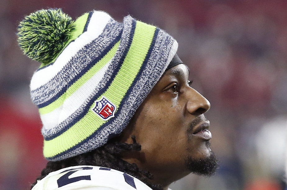 caption: Seattle Seahawks' Marshawn Lynch watches the closing moments of an NFL football game against the Arizona Cardinals Sunday, Dec. 21, 2014.