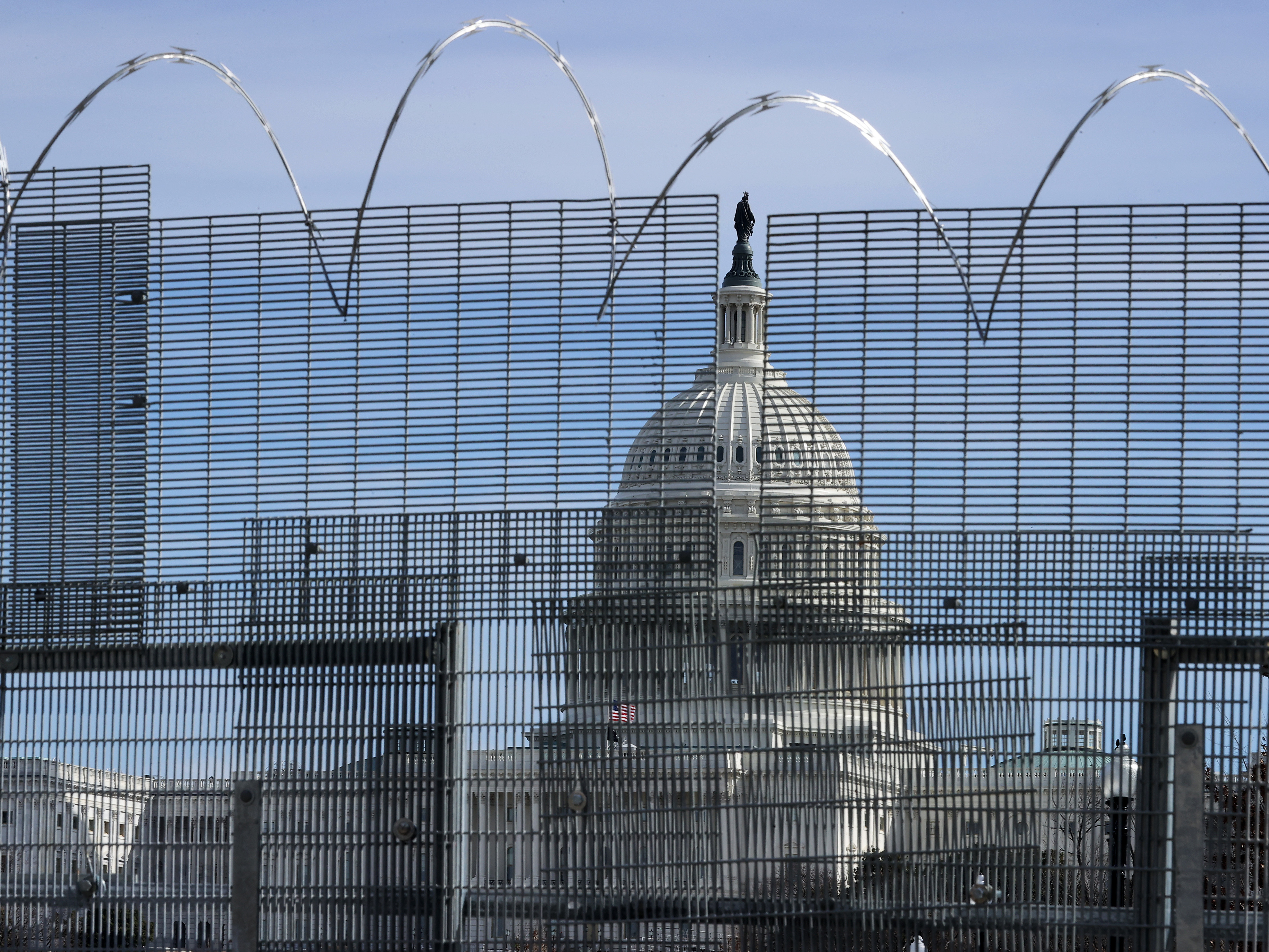 caption: The cost of repairing or replacing historic items damaged in the Jan. 6 riot "will be considerable," Architect of the Capitol J. Brett told lawmakers Wednesday. Other costs include maintaining a security fence topped with concertina razor wire, which surrounds the U.S. Capitol grounds.