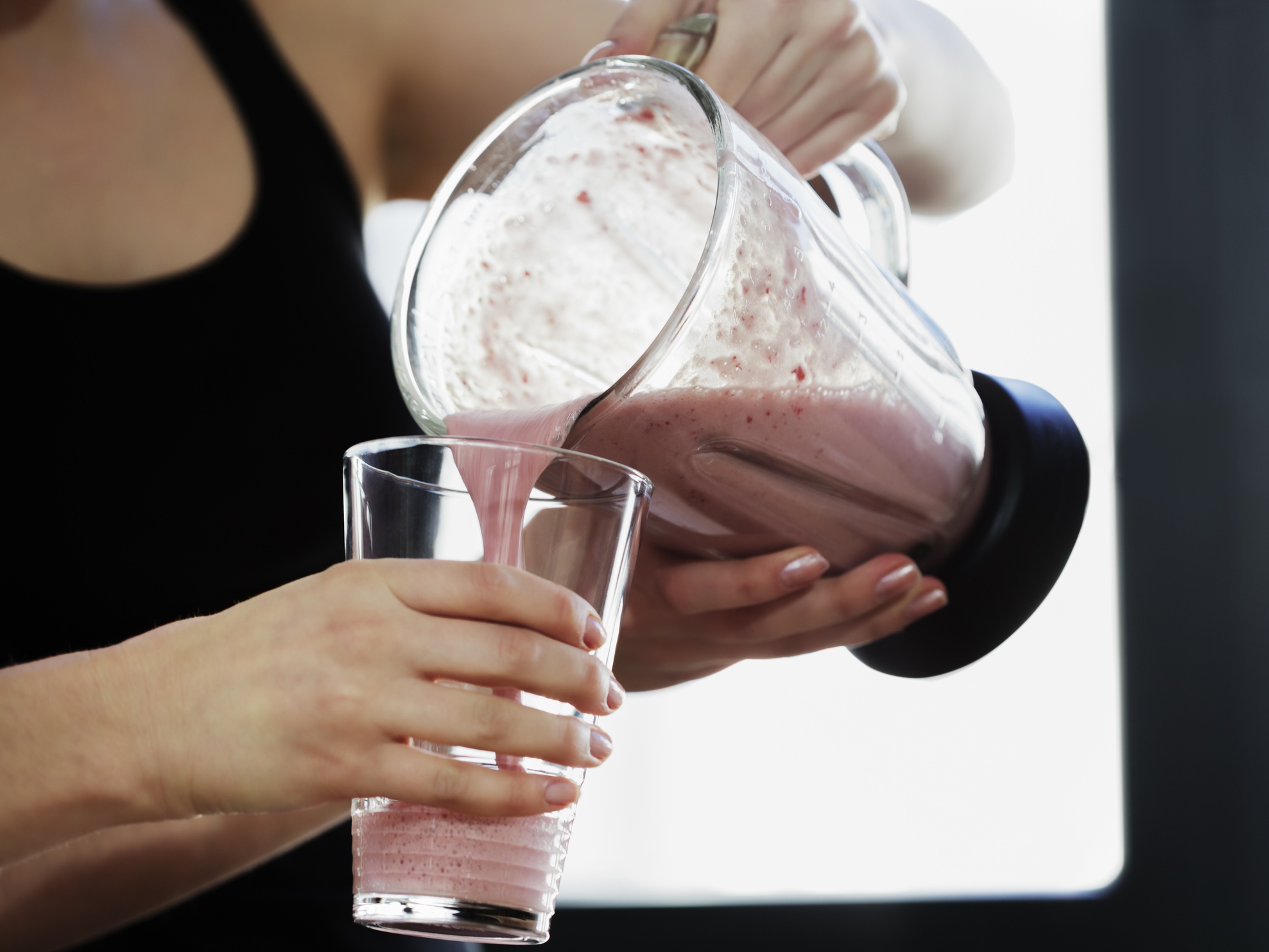 Close-Up of Woman Pouring a Meal Replacement Shakes