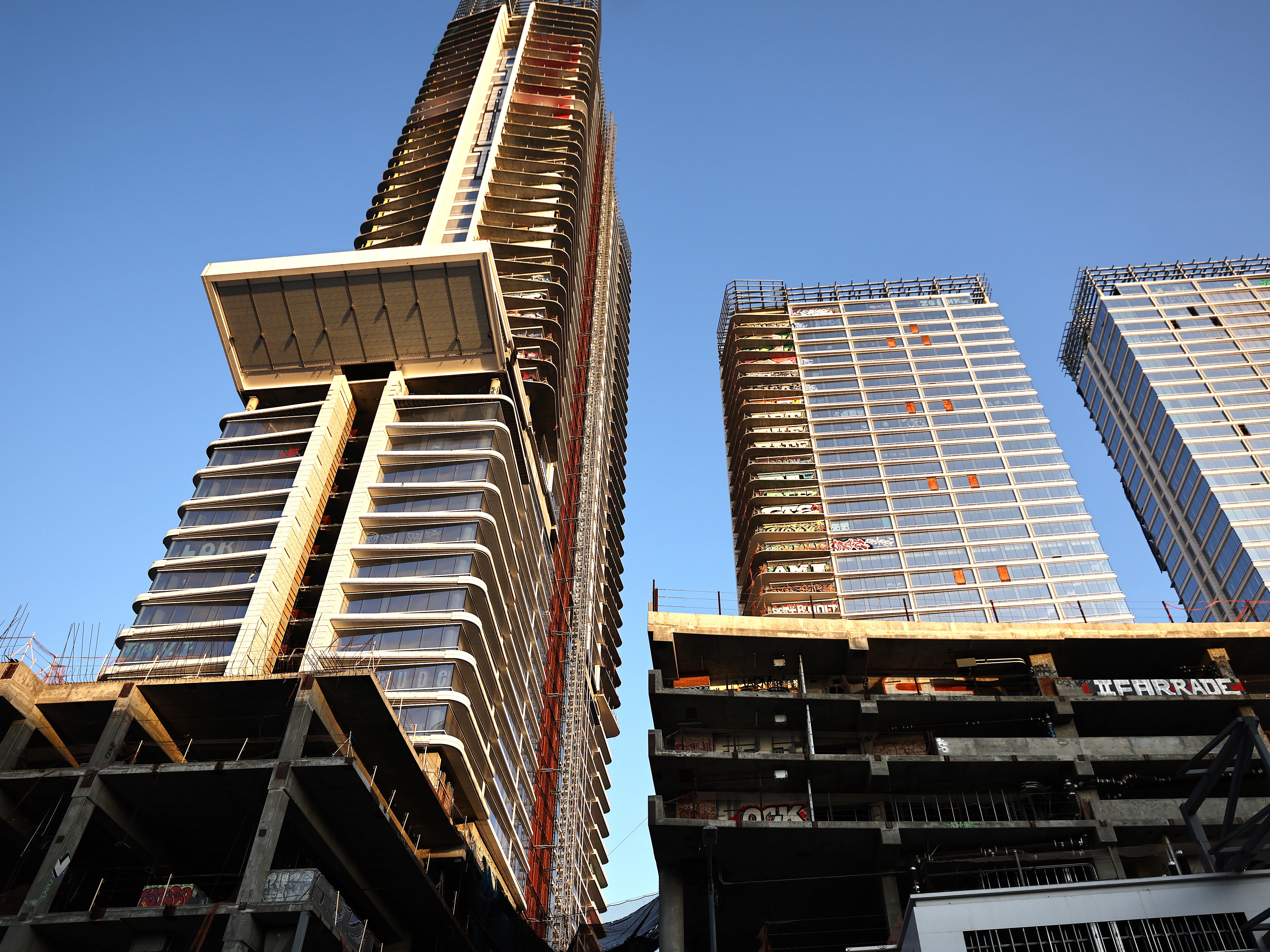caption: Construction of this $1 billion luxury real estate development in Los Angeles stalled in 2019 after a China-based developer ran out of funding, leaving the three-tower project unfinished amid a housing crisis in the city.