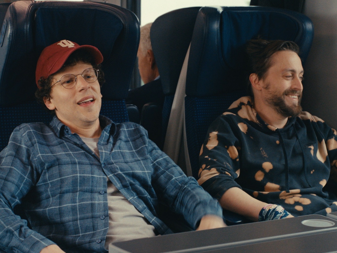 caption: Jesse Eisenberg and Kieran Culkin star as cousins who take a Jewish heritage tour in Poland in <em>A Real Pain. </em>