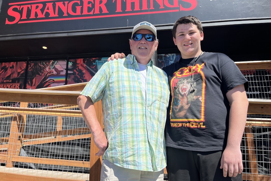 caption: Keith Farley Sr. and his son, Keith Farley Jr., at "Stranger Things: The Experience" in Seattle’s Stadium District.