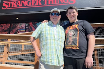 caption: Keith Farley Sr. and his son, Keith Farley Jr., at "Stranger Things: The Experience" in Seattle’s Stadium District.
