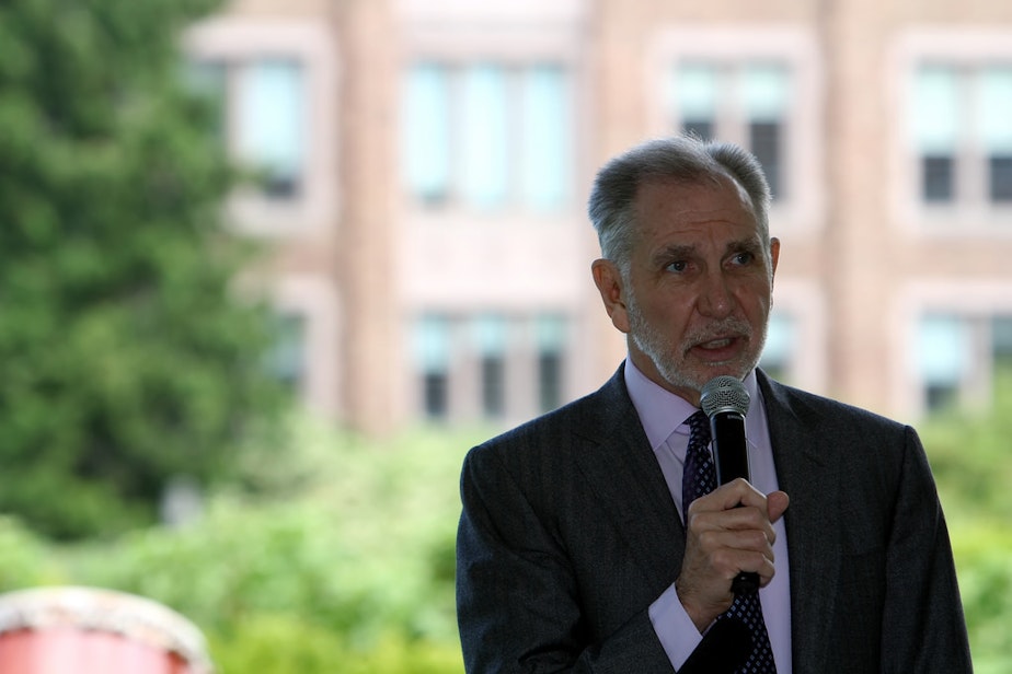 caption: Michael Young speaks at a cherry tree gift reception at the University of Washington on May 20, 2014.