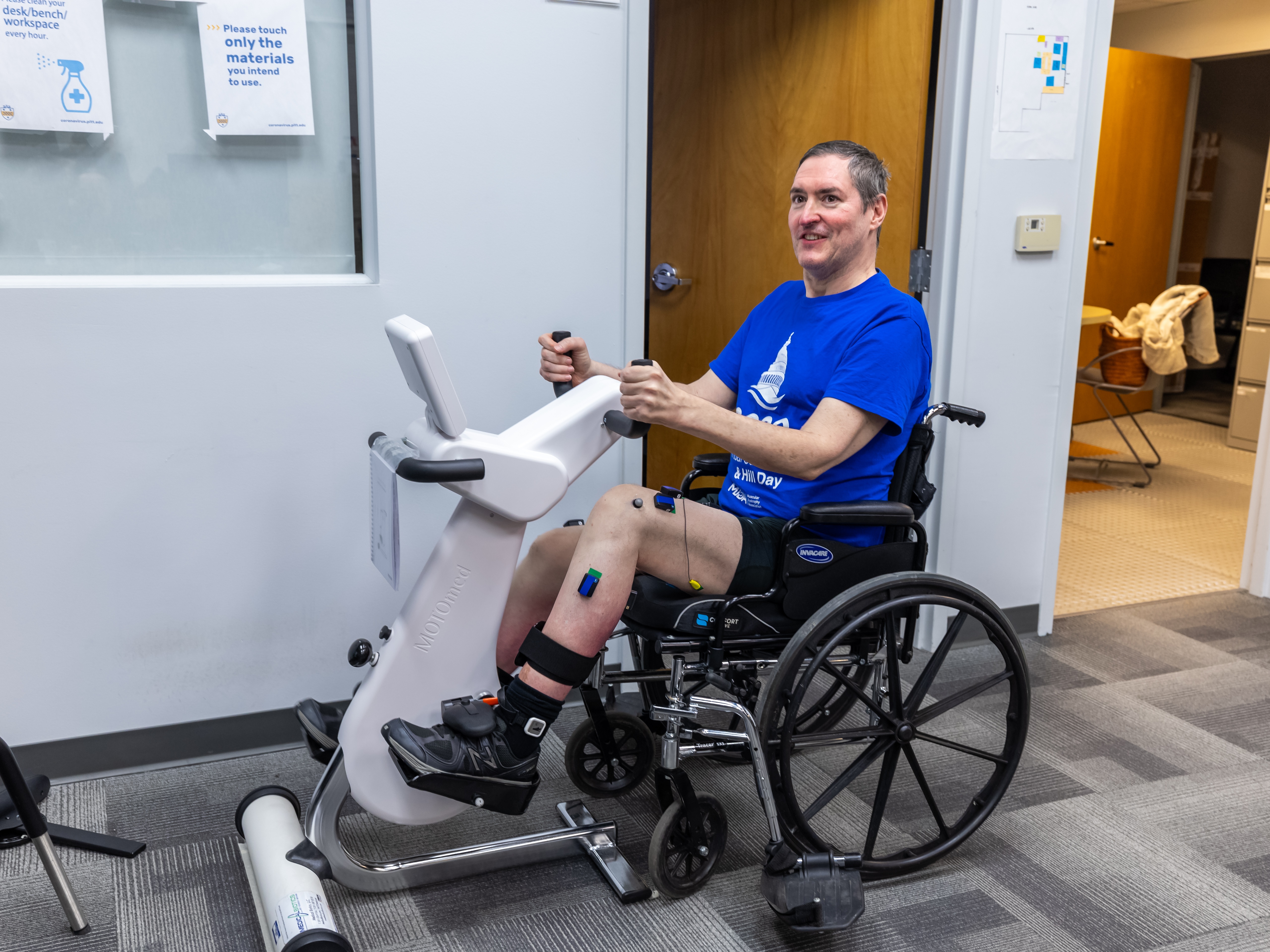 caption: Research participant Doug McCullough uses the adaptive exercise bike during a testing session at the University of Pittsburgh.