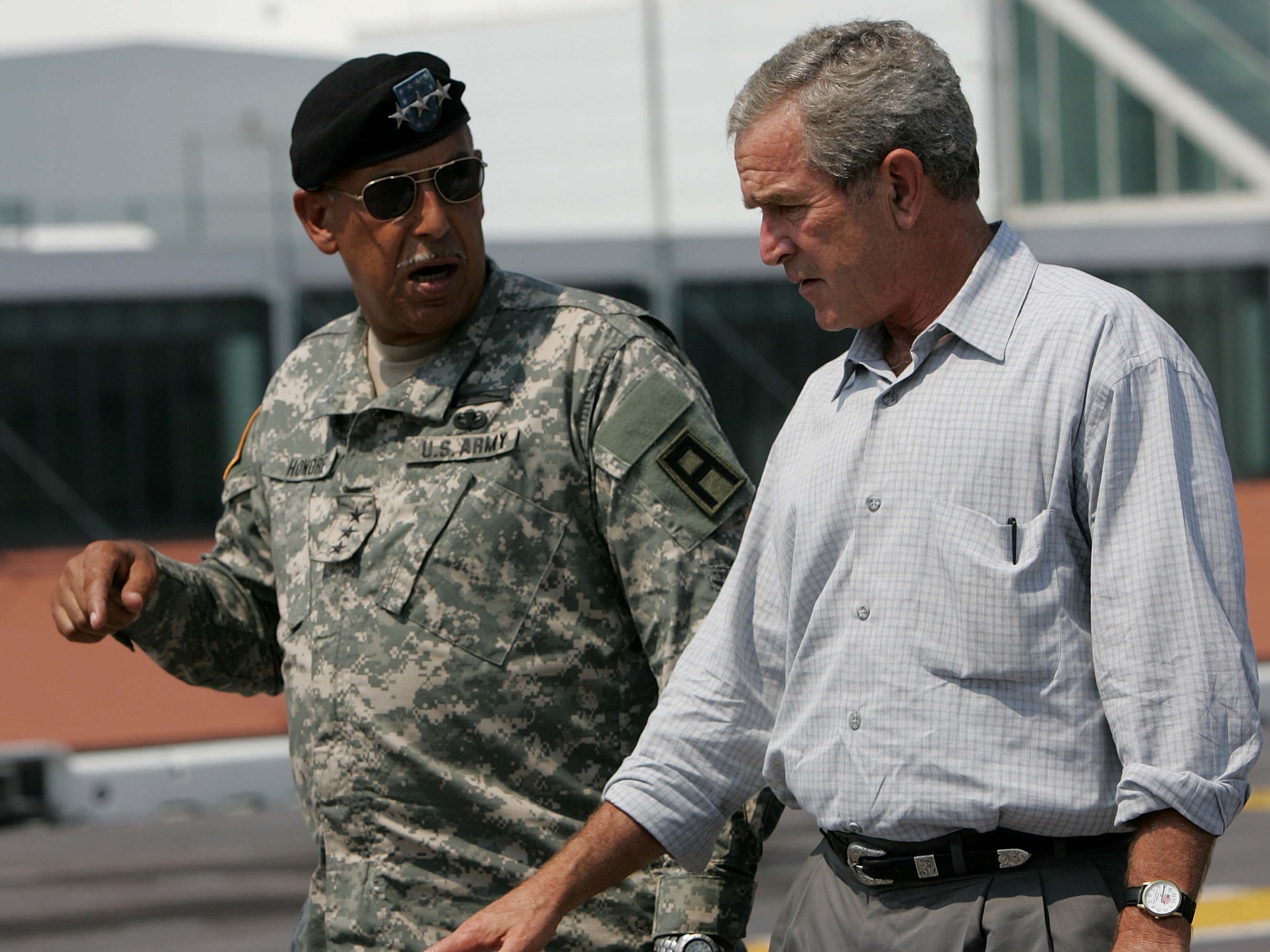 caption: Then-U.S. President George W. Bush talks with then-U.S. Army Lt. Gen. Russel Honoré on the flight deck of the USS Iwo Jima on Sept. 20, 2005, in New Orleans, La.